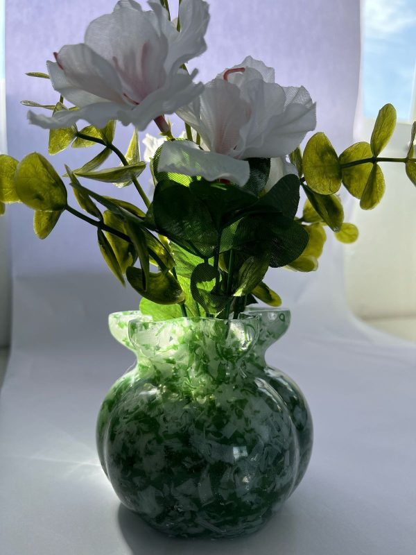 Handcrafted diffusers and vases made from recycled textiles.